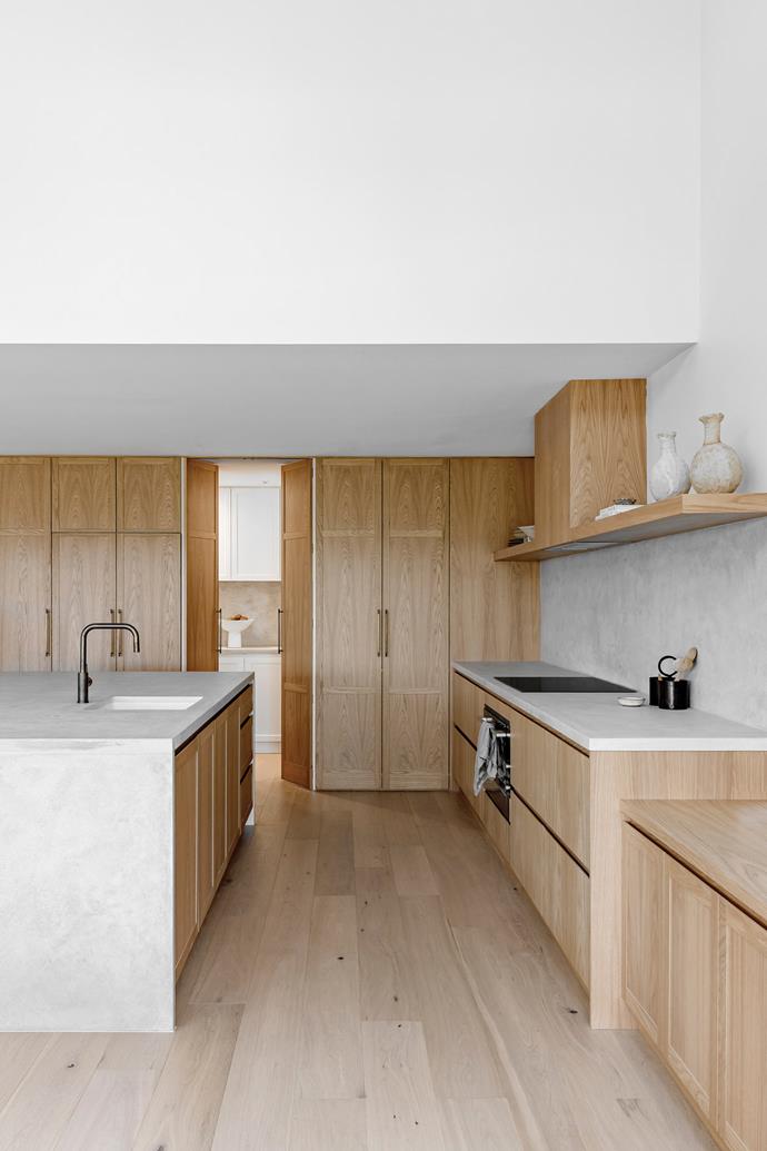 "We needed to update the existing floor as it was very scratched and red-toned, plus it would dictate what shade of timber we used in the kitchen," says Kate. "Even if we'd sanded and whitewashed it, the colour would have a pink undertone." She chose fresh Pale Oak flooring by Woodcut. A butler's pantry was part of the original kitchen but is now concealed behind cabinetry. As for the [concrete benchtops](https://www.homestolove.com.au/concrete-benchtops-pros-and-cons-23200|target="_blank"), some of Kate's clients have them and all say they are amazing. "That gave Mum the confidence it would be just as good as the granite she previously had." Antique brass tapware, [Faucet Strommen](https://www.faucetstrommen.com.au/|target="_blank"|rel="nofollow").