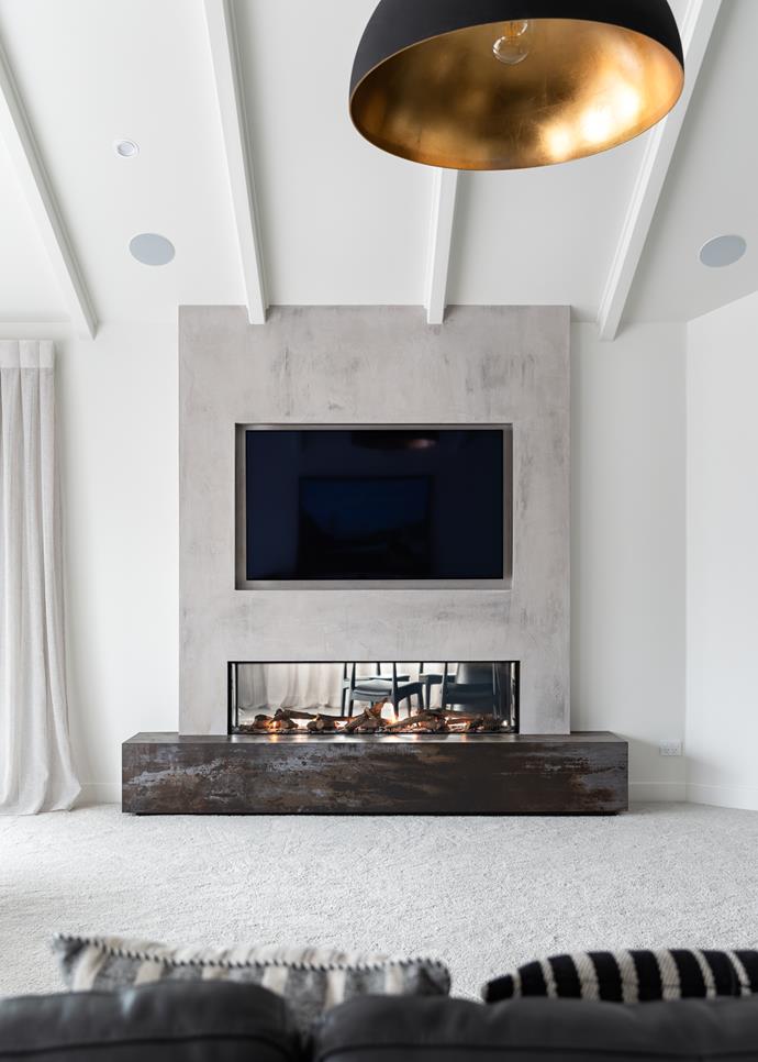 Not only is it a striking design feature, this DS series double-sided fireplace by Escea warms two separate rooms simultaneously. It also ensures the TV isn't the only focal point in the room.
