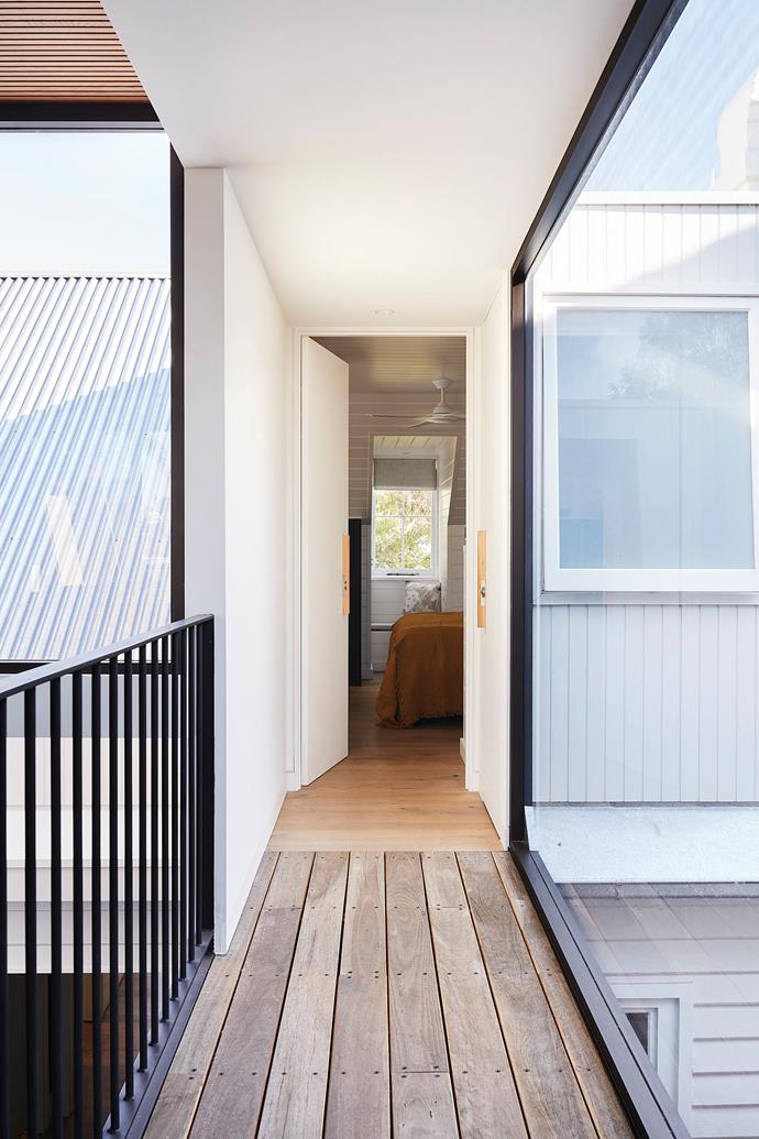 **TOP-FLOOR BRIDGE** The couple wanted to clearly demarcate the old and new sections with a bridge over the ground-floor courtyard. Flowing from the new main bedroom to the living areas, it has floor-to- ceiling glass walls and recycled timber decking. The flooring is Iron Deck from [Ironwood Australia](https://ironwood.com.au/|target="_blank"|rel="nofollow"), sawn and wire-brushed.
