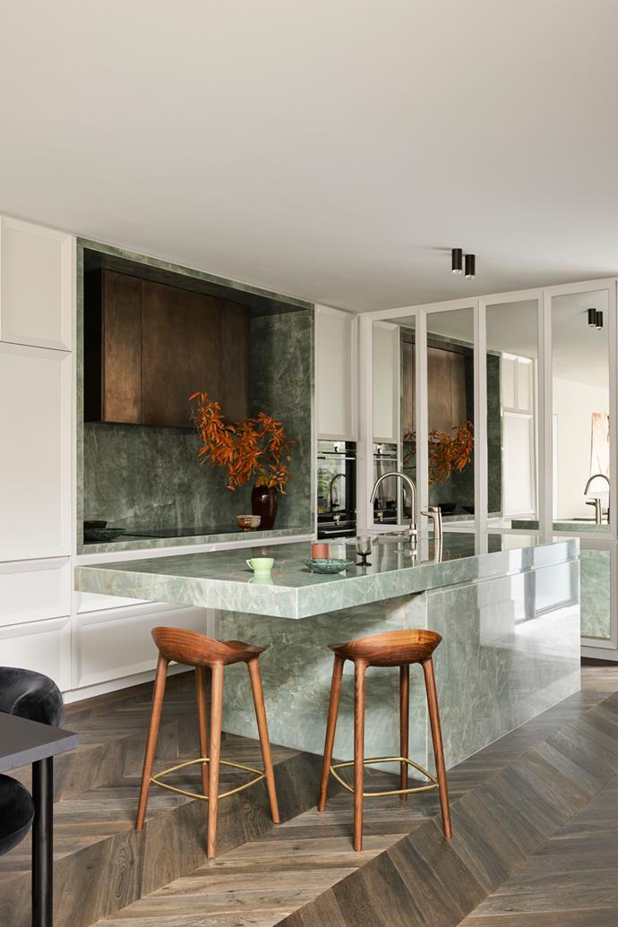 Centrestage in the kitchen of [this stylish semi in Dover Heights](https://www.homestolove.com.au/smac-studio-european-inspired-home-23641|target="_blank") is a cantilevered Esmeralda quartzite kitchen island, which carries the same tones as the powder room downstairs. "It's got depth and character, but it's also quite airy. Kind of ethereal," says interior architect and Smac Studio principal Shona McElroy of the jewel-like stone that took months to source.