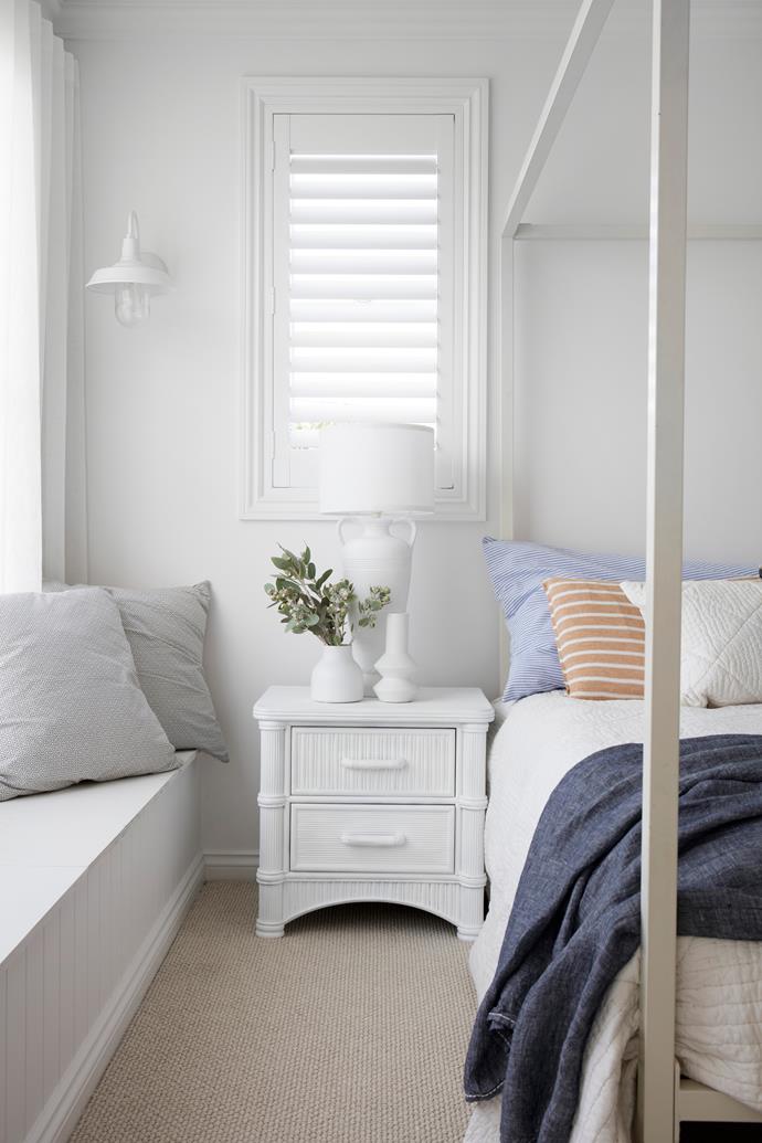 A bed from Incy Interiors is dressed in custom ink linen bedding from [Tahn Interiors](https://www.tahninteriors.com.au/|target="_blank"|rel="nofollow") and a striped bedhead cushion made by Courtney.
