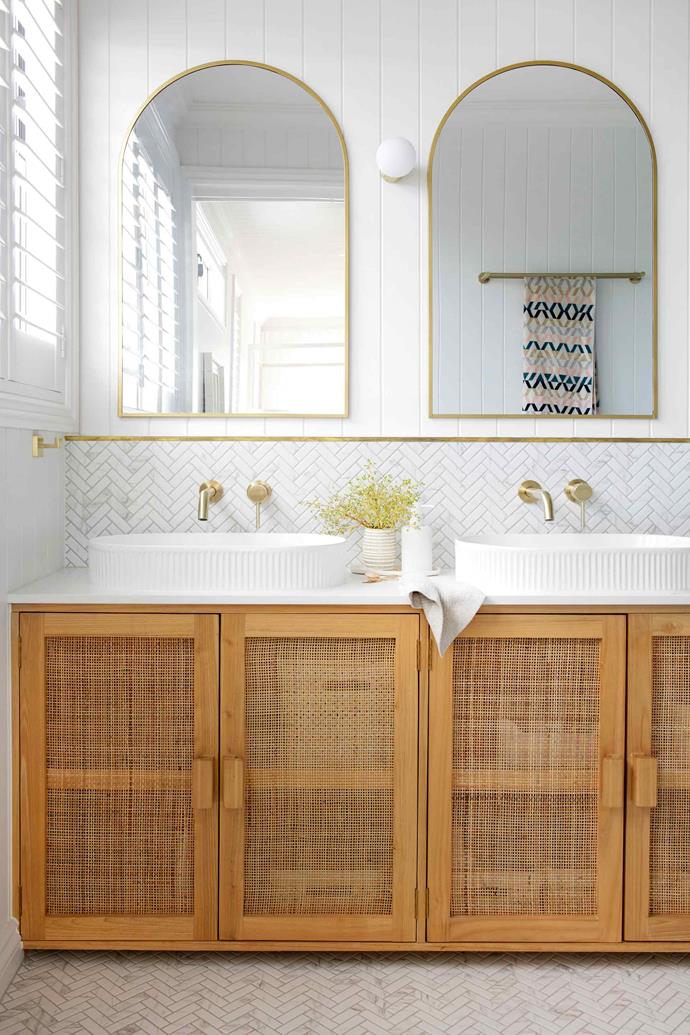 **MAIN ENSUITE** Courtney coveted brass mirrors for the bathrooms but at hundreds of dollars each, she decided to save money by spray painting Kmart mirrors in brass. Custom timber vanity by [Hello Trader](https://hellotrader.com.au/|target="_blank"|rel="nofollow").