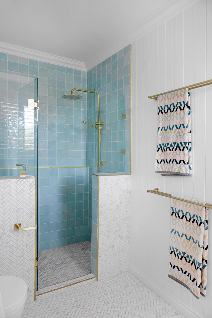 **MAIN ENSUITE** Courtney added a coastal touch to the main ensuite shower with 'Clay' tiles in Aqua from [Beaumont Tiles](https://www.beaumont-tiles.com.au/|target="_blank"|rel="nofollow"). The brass hinges on the shower screen are from Abi Interiors as is the 'Cali' double shower rail.