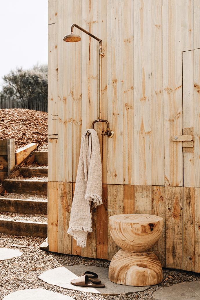 The [outdoor shower](https://www.homestolove.com.au/outdoor-shower-ideas-19532|target="_blank") is hooked up to hot water for a luxurious post-swim rinse.