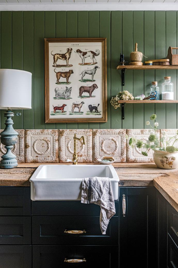 A dark sage adorns this [restored historic bungalow in Blackbutt, Queensland.](https://www.homestolove.com.au/restored-historic-bungalow-green-hills-23863|target="_blank") In this stunning laundry, old rails from the sheep run have been repurposed as benchtops, with the eclectic mix of materials giving it a unique look.