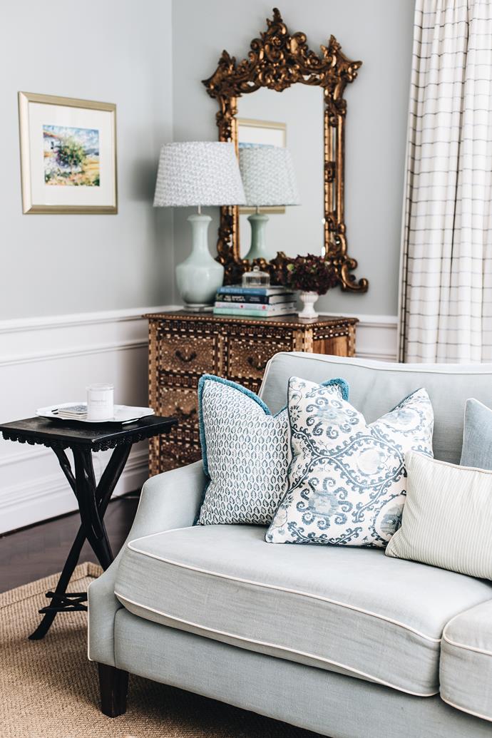 "The room is a mix of precious antiques, vintage finds, new and upcycled pieces, all custom upholstered with beautiful fabrics and finished with bespoke cushions," says Melinda, who styled mismatching cream and blue sofas. "Cushions are an easy way to enliven a room," says Melinda. Table by [Joe Vinks](https://www.facebook.com/Joe-Vinks-Eco-Design-331587170287114/|target="_blank"|rel="nofollow").