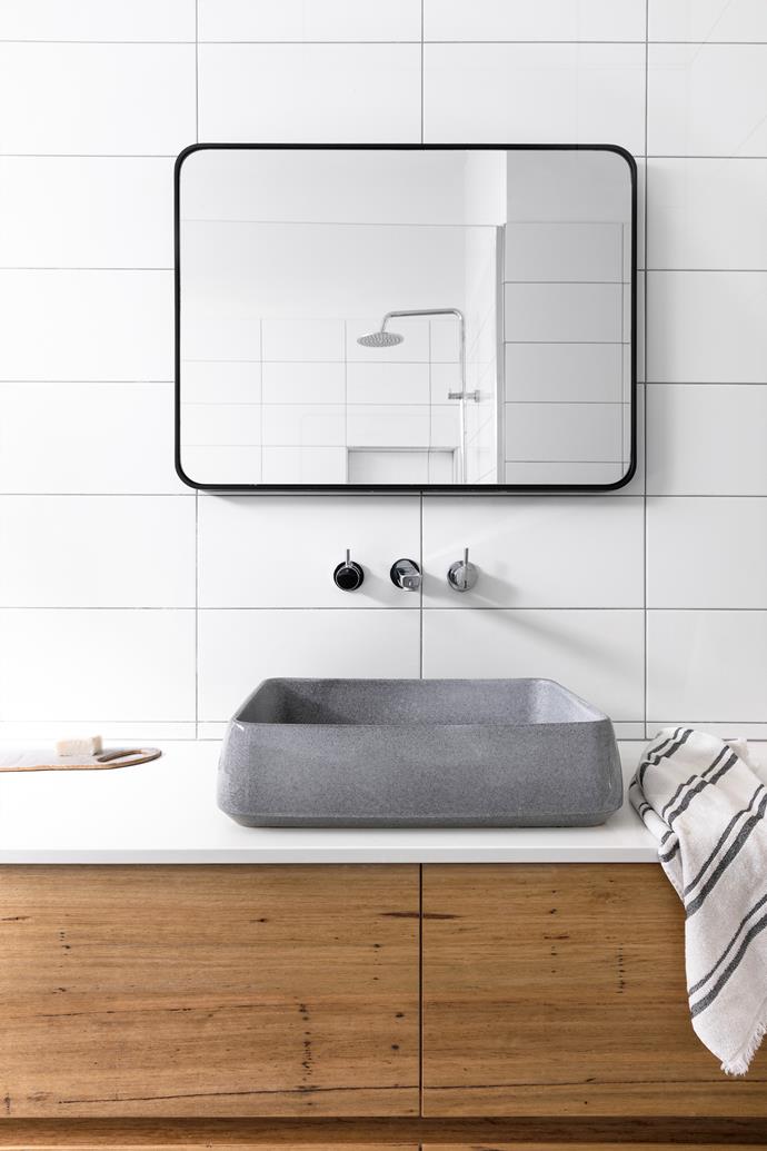 The bathroom features wall tiles from [Beaumont Tiles](https://www.beaumont-tiles.com.au/|target="_blank"|rel="nofollow") and a blackbutt vanity with a Caesarstone top and a [Robert Gordon Interiors](https://www.robertgordoninteriors.com/|target="_blank"|rel="nofollow") basin. The tapware is [Reece](https://www.reece.com.au/|target="_blank"|rel="nofollow") and the mirror was sourced from [Middle of Nowhere](https://middleofnowhere.com.au/|target="_blank"|rel="nofollow").