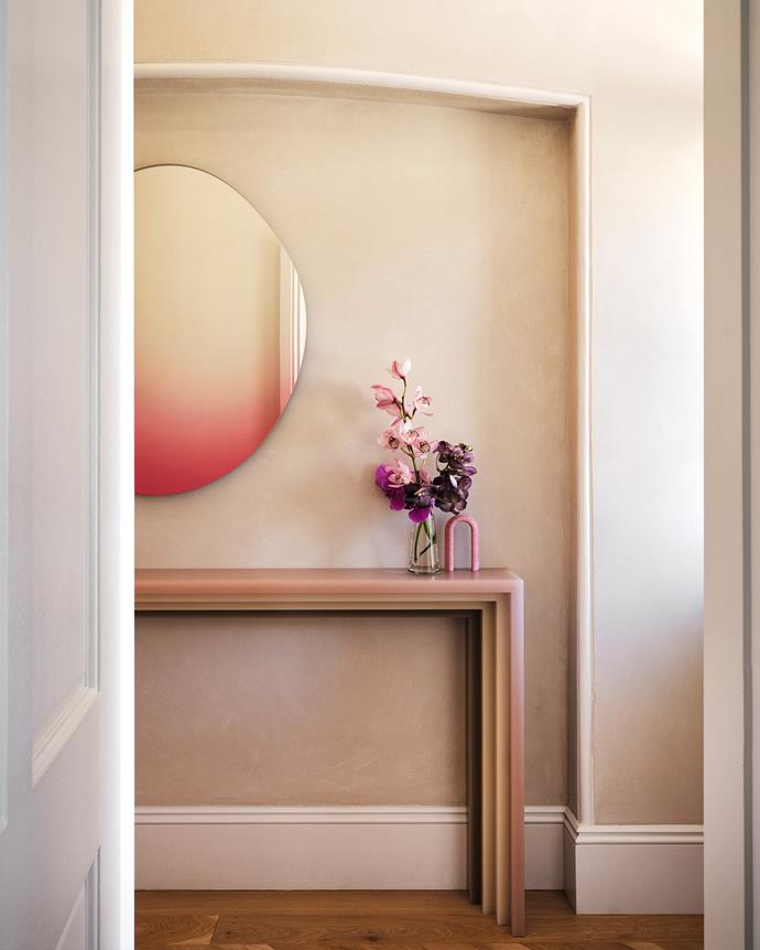 When designing the hallway, [Decus Interiors](https://decus.com.au/|target="_blank"|rel="nofollow") was led by the goal to create a "consistent design language that would set the tone for the house". Various colours of [Marblo](https://www.marblo.com.au/|target="_blank"|rel="nofollow") was used to create the custom-made console that's affixed to the wall with small steel rods and adhesive, with the design of the console referencing the skirting.