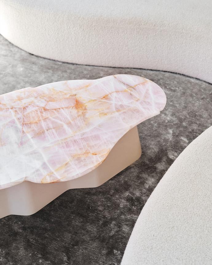 Blush [quartzite](https://www.homestolove.com.au/crystal-quartz-home-decor-22246|target="_blank") was used for the custom-made coffee tabletop with a gloss two-pack finish on the base in a custom colour. Decus designed the coffee table and made sure it was 3D modelled before being brought to life by the joiners. "We wanted a truly unique piece for the coffee table," says Alexandra.