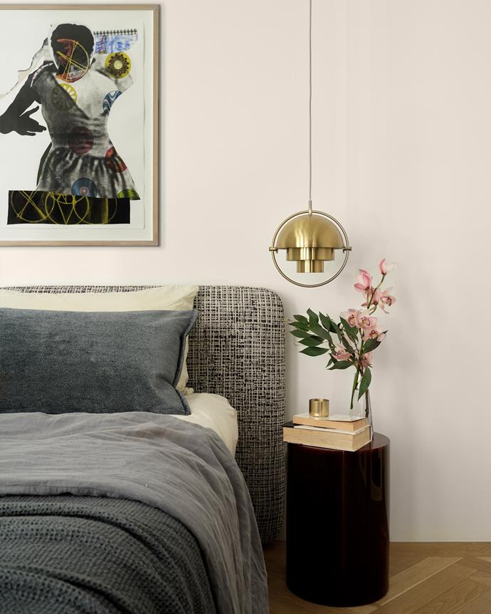 Polished brass adds shine to the bedroom in the form of a [Multi-lite pendant from Gubi](https://gubi.com/en/us/products/multi-lite-pendant|target="_blank"|rel="nofollow"). The light hangs alongside artwork by Sally Smart and above a custom [Sabine Marcelis](https://sabinemarcelis.com/|target="_blank"|rel="nofollow") bedside table.