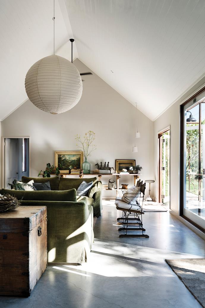 The high ceiling creates an airy feel in the living room, which is painted in [Resene](https://www.resene.com.au/|target="_blank"|rel="nofollow") Half Truffle.