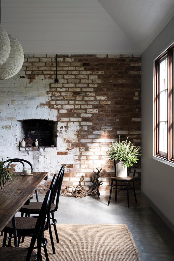 [Exposed brick walls](https://www.homestolove.com.au/brick-statement-walls-19098|target="_blank"), including the building's original bread oven, are a link to the past.
