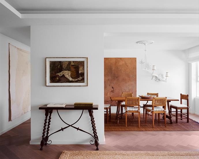 The third bedroom was opened up to allow for a larger living and dining zone. A European still life from auction house Shapiro hangs above a Spanish console from Tamsin Johnson.