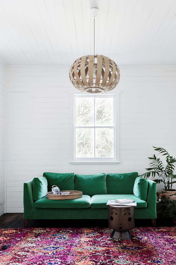 An emerald-green velvet sofa adds a sense of playful formality to this [Byron Bay beach shack](https://www.homestolove.com.au/byron-bay-beach-shack-given-bohemian-makeover-6809|target="_blank"). "Just about all my couches are velvet," says owner Sonya Marish, director of [Jatana Interiors](https://www.jatanainteriors.com.au/|target="_blank"|rel="nofollow"). "I'm really into comfort, warmth and homeliness."