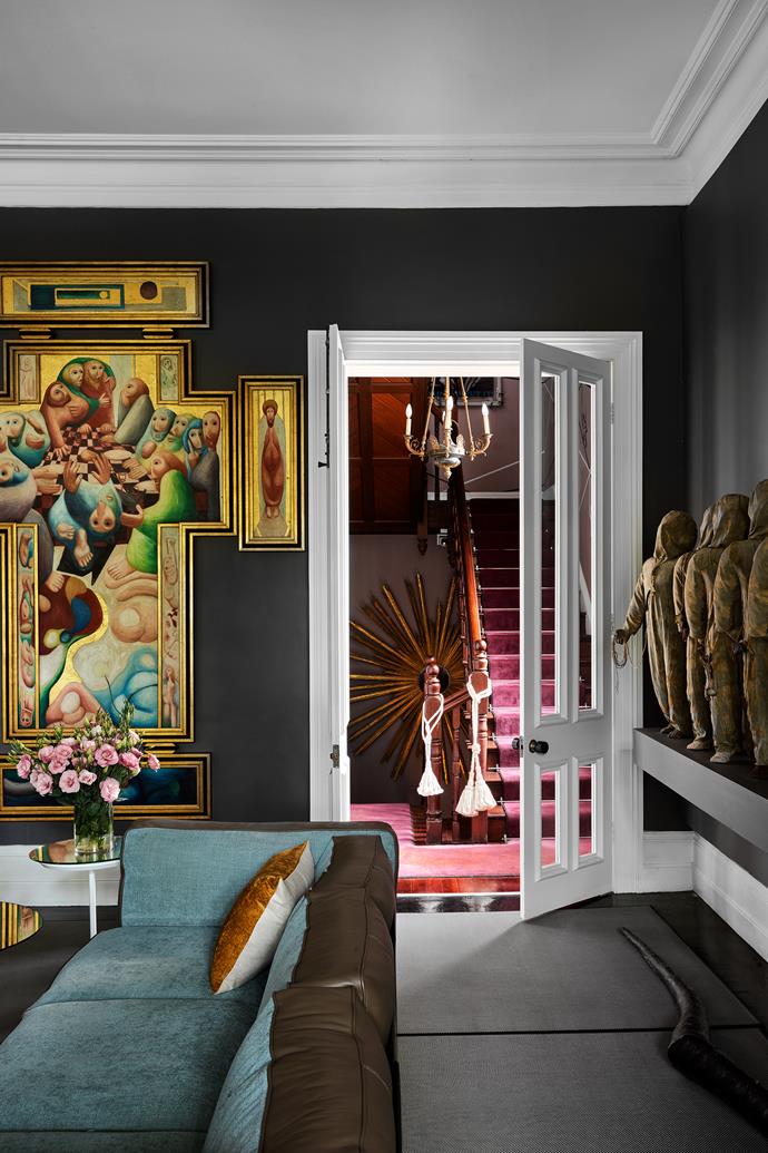 Keith Looby's work The Last Supper presides over the living room on the second floor and comprises a Celtic cross in five panels. A Peter D. Cole sculpture stands on one of the mirror tables. An 18th-century Italian sunburst mirror radiates on the landing.