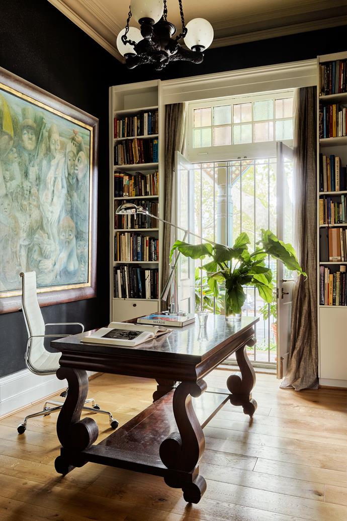 Tony's street-level study displays a Keith Looby artwork behind the antique desk which is attended by a Herman Miller chair by Charles and Ray Eames. This work once hung in the dining room and was another that served as a talking point with its confronting, deranged faces. Desk lamp by Ralph Lauren. Original argon gas pendant light.
