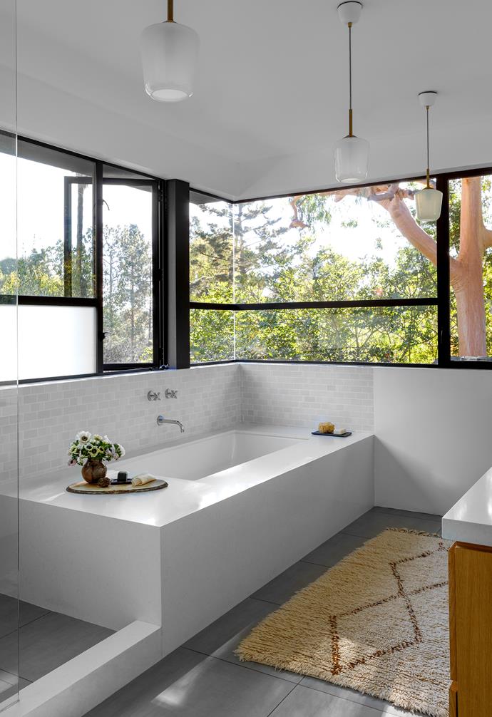 **ENSUITE** Across this section of the house, "ribbon windows reveal an almost abstract composition of bright and dark leaves, adjacent tree trunks, heavy boughs, swaying branches and glimpses of distant hillside and sky," says David.