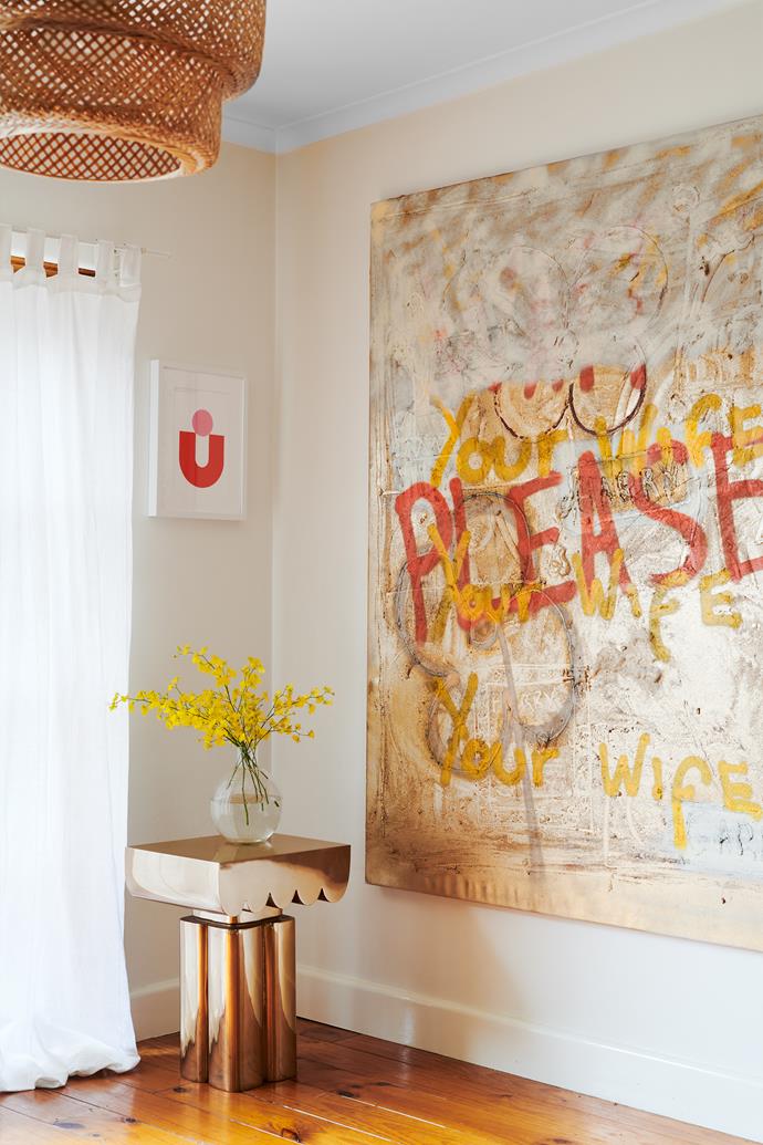 Stay gold: The side table and large artwork are by Steve; the small artwork is by Bobby.