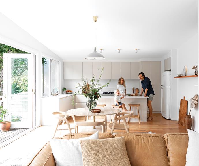 **LIVING AREA** "We sanded back the original kauri floorboards, which had developed an orange tint, and applied a Scandinavian-inspired raw matt finish. I am thrilled with the outcome," says Heidi. In the kitchen, two-pack joinery in [Dulux](https://www.dulux.com.au/|target="_blank"|rel="nofollow") Stone Master was matched with [Caesarstone](https://www.caesarstone.com.au/|target="_blank"|rel="nofollow") benchtops in Palm Shade. Fridge, [Smeg](https://www.smeg.com.au/|target="_blank"|rel="nofollow"). Odd barstools, [GlobeWest](https://www.globewest.com.au/|target="_blank"|rel="nofollow").