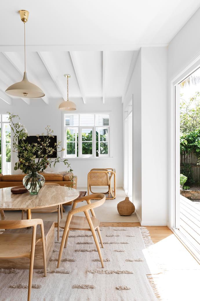 **DINING AREA** With its beautiful shade and frosted-glass diffuser, the Gubi '1965' pendant light complements the round dining table. Cubix travertine table, [Coco Republic](https://www.cocorepublic.com.au/|target="_blank"|rel="nofollow"). Maki dining chairs, [MCM House](https://www.mcmhouse.com/|target="_blank"|rel="nofollow"). Ethiopian sheep-wool rug by [Anna Pirkola](https://www.finnishdesignshop.com/Anna_Pirkola-d-1157.html|target="_blank"|rel="nofollow"). Spanish recycled-glass vase, a retro find. Walls in [Dulux](https://www.dulux.com.au/|target="_blank"|rel="nofollow") Natural White.