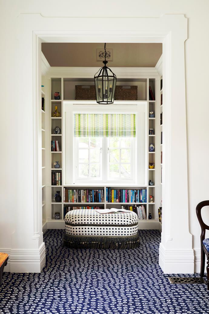 **LIBRARY** A library nook flows from the sitting room and "evokes a wonderful feeling walking from such a large open space into a small room wrapped in books", says Anna. The blinds are in Anna Spiro Textiles 'Kahuna Multi' fabric in a custom colourway.