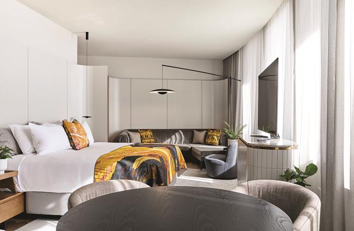 The yellow and charcoal grey colour palette extends to the suites upstairs.