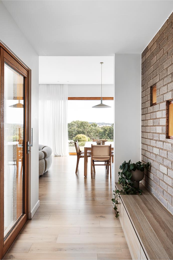 The vestibule serves an important purpose in this H-shaped build, connecting the living and dining zones to the bedrooms and bathrooms. [Large windows](https://www.homestolove.com.au/house-window-styles-and-names-5514|target="_blank"), which allow an unobstructed view to the gorgeous greenery encircling the home, create cohesion and consistency between these two areas.