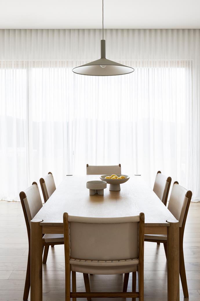 Timber [Barnaby Lane](https://barnabylane.com.au/|target="_blank"|rel="nofollow") dining chairs add warmth to this space. [Sheer curtains](https://www.homestolove.com.au/how-to-pick-the-right-window-treatments-2524|target="_blank") diffuse the sunlight while blackout curtains on a separate track provide total darkness when required.