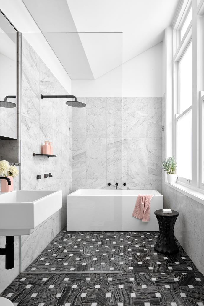 Designer Greg Natale is known for his inspired use of geometric shapes and patterns, and the 'MarmoII Rubato' floor tiles from his own collection with Teranova, featured in the bathroom of [this Newcastle apartment](https://www.homestolove.com.au/art-ryan-apartment-newcastle-23507|target="_blank") are no exception. 