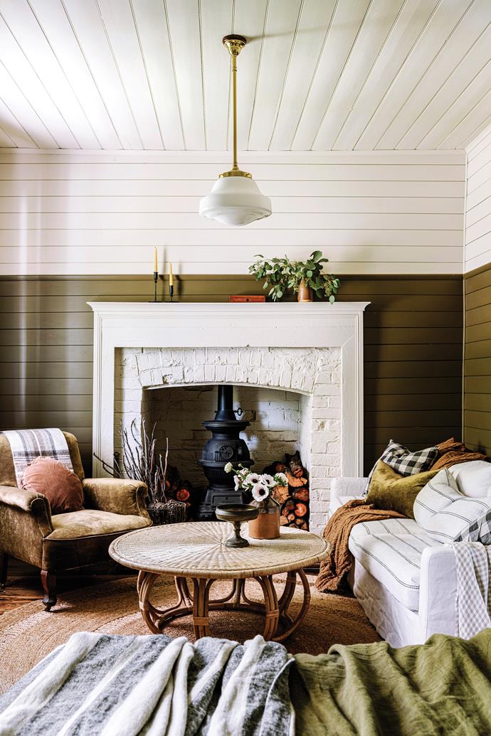 Tucked away in a tiny town in Victoria, Dry Diggings, [this heritage home](https://www.homestolove.com.au/restored-heritage-cottage-dry-diggings-vic-23981|target="_blank") was restored with the gentlest of hands. Sarah and Ben, who have since sold the property, discovered the original stone fireplace beneath a modern façade in the living room, and later installed a pot-belly wood heater for warmth in winter.