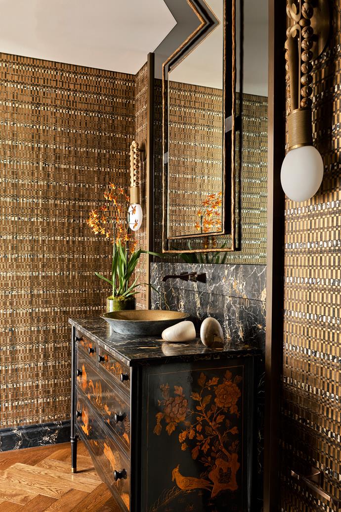 If not for the bespoke basin from Boyd Alternatives, you may mistake [this powder room](https://www.homestolove.com.au/traditional-style-home-eclectic-interiors-thomas-hamel-24316|target="_blank") for an incredibly elegant entryway. Full of delightful design and eclectic style, the wallpapered space also features a  neoclassical commode with Chinoiserie decoration from Objets Plus in New York and mirror from Osanna Visconti in Milan.
