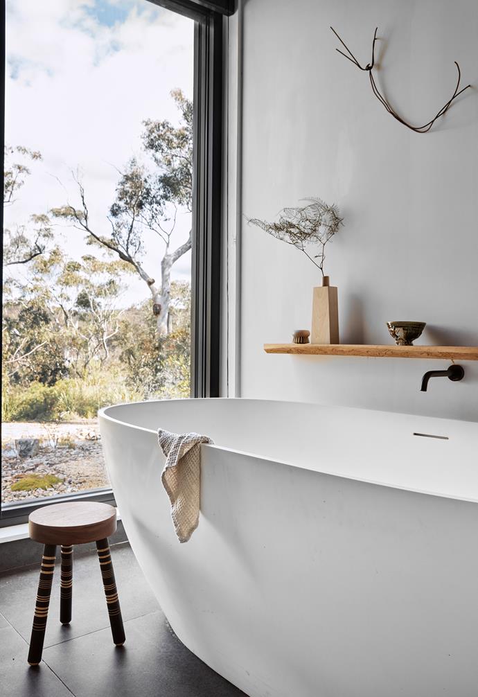 [In this masterful new build in the Blue Mountains](https://www.homestolove.com.au/bushfire-resistant-home-megalong-valley-nsw-24351|target="_blank"), the serene white bathroom looks out over the sublime natural vista to create the ultimate spot for relaxation. 