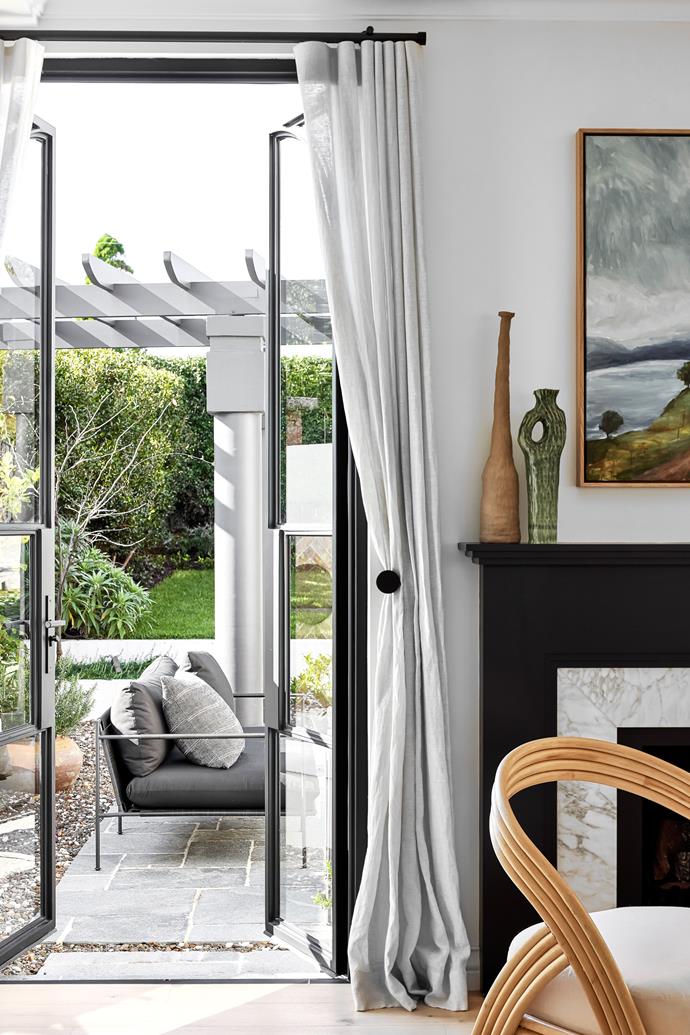 A monochrome palette with splashes of grey, brown and green creates a strong link between the indoor and outdoor spaces of this [sundrenched home on Sydney's northern beaches](https://www.homestolove.com.au/1950s-home-makeover-sydney-northern-beaches-24441|target="_blank").