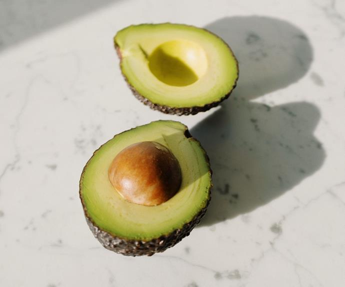 Since exposure to oxygen is what turns your vibrant green avocado brown, placing it cut into an airtight container will help prevent that from happening.