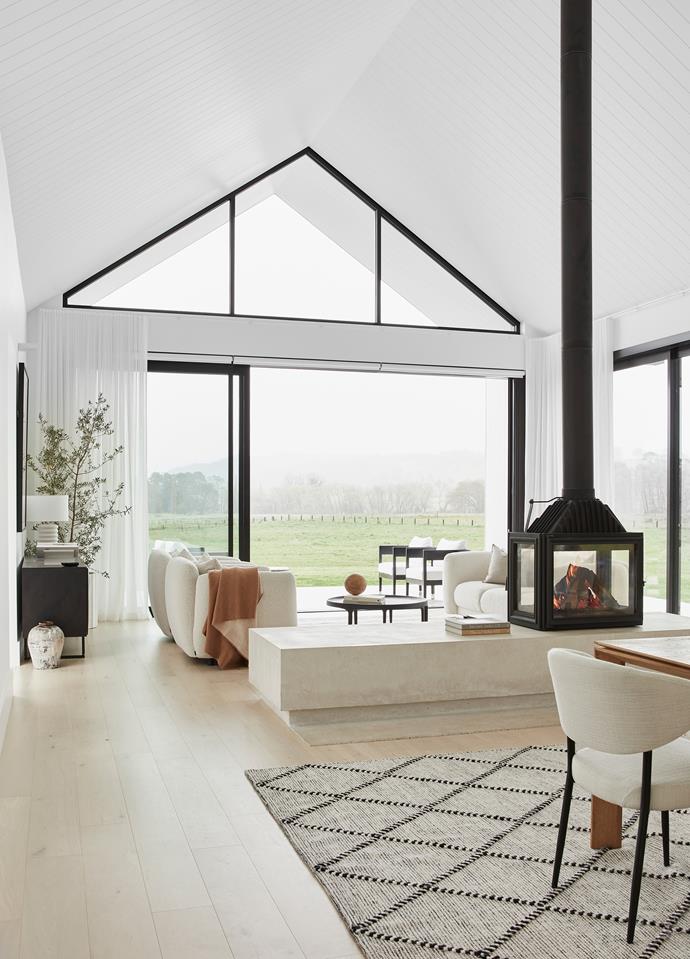 A bright modern country home, [this new build in Bowral](https://www.homestolove.com.au/white-modern-country-home-bowral-nsw-24822|target="_blank") carries its defining theme of white, steel and glass, contrast into a stunning fireplace.