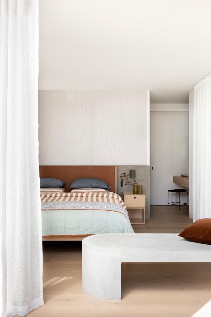 A subtle Venetian plaster render in Dulux Vivid White calms the bedroom of this [mid-century meets contemporary home in Torquay](https://www.homestolove.com.au/contemporary-mid-century-inspired-home-torquay-24881|target="_blank").