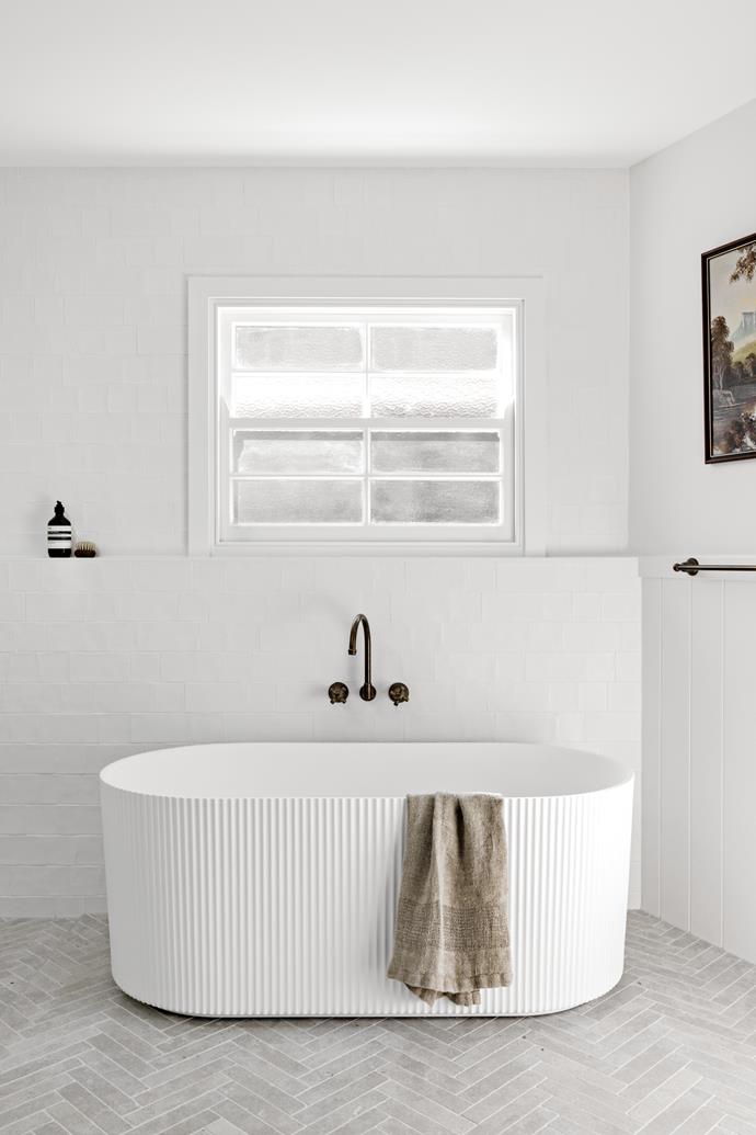 A [1920s sandstone cottage in Helensburgh](https://www.homestolove.com.au/renovated-1920s-sandstone-cottage-helensburgh-24912|target="_blank") uses a mix of texture and pattern to transform their bathroom into a functional, stylish element of the home.