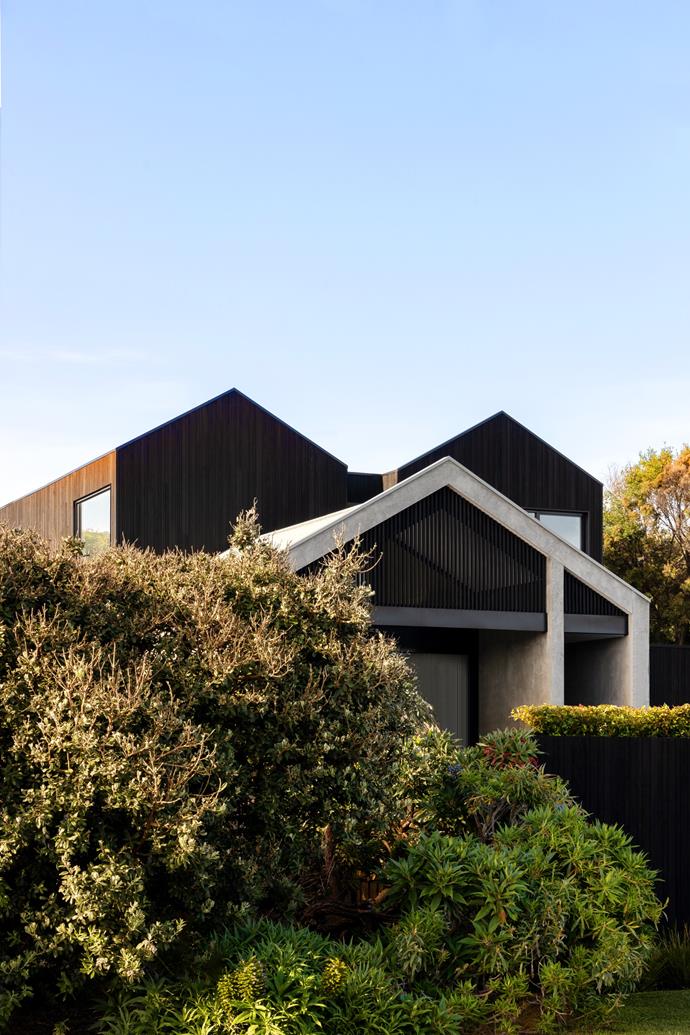 Instead of succumbing to the predictable tropes of coastal homes (think: white, weatherboards etc.) this urban home, [situated in Barwon Heads](https://www.homestolove.com.au/contemporary-beach-house-barwon-heads-25023|target="_blank"), sets itself apart with a triple-peaked facade and a muted, contemporary colour palette.