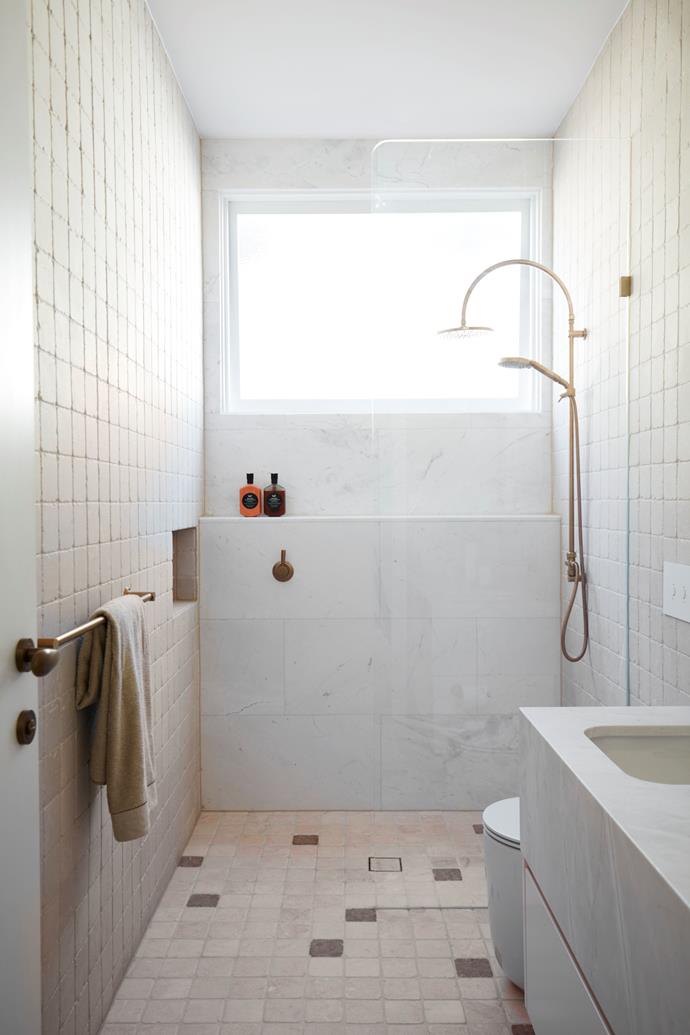 [A tropical resort-style semi](https://www.homestolove.com.au/tropical-resort-style-semi-eastern-suburbs-25079|target="_blank") translates its coastal surroundings into its interiors to beautiful effect. This walk-in shower, for example, features a pale pink colour palette reminiscent of multicoloured, sparkling Sydney sunsets.