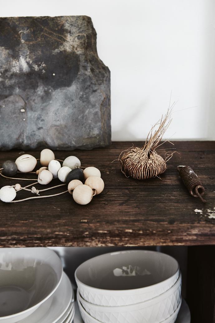 The recycled benchtop in the kitchen displays some of Kate's favourite things, including a string of wooden and clay beads from Tasmanian-based store, [Bellebird Handmade](http://bellebirdhandmade.bigcartel.com/).