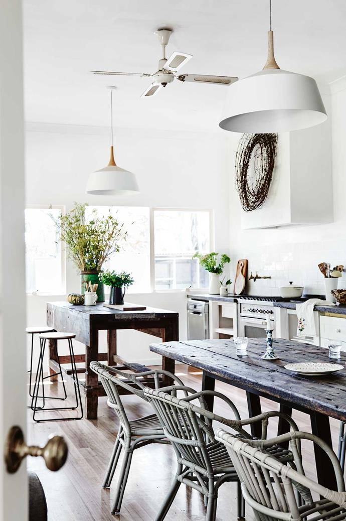A wreath that Kate made from rusty farm wire makes a focal point above the [concrete benchtop](https://www.homestolove.com.au/a-guide-to-kitchen-benchtop-surfaces-2444|target="_blank"). A concrete panel was also made for the centre of the island — a workbench that has been repurposed. Ordinary garden taps overhang the kitchen sink.
