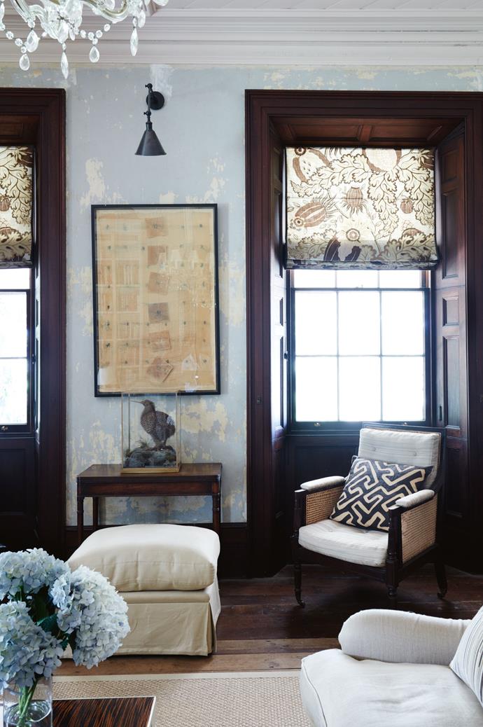 An artwork by the late Maureen van der Giessen hangs in the library. The [19th-century armchair](https://www.homestolove.com.au/choosing-an-armchair-3851|target="_blank") upholstered in blonde horsehair is complemented by a Kuba cloth cushion, made from fabric the couple bought in the Marche aux Puces de Saint-Ouen, France.