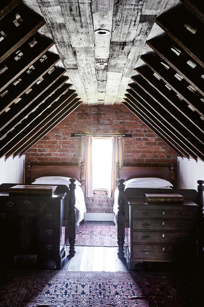 The attic at Nile Farm still has the original exposed shingles under the roof. The Westmores [transformed the former storage space into a bedroom](https://www.homestolove.com.au/before-and-after-attic-conversion-3699|target="_blank"). The old pit-sawn floorboards that run through the rest of the house were damaged in the attic and covered with recycled wood palings.