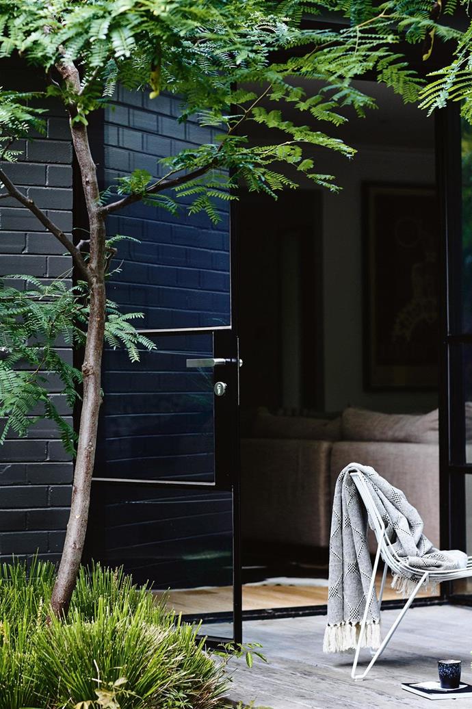 **Monochrome with colour** [Kerb appeal](https://www.homestolove.com.au/kerb-appeal-ideas-for-styling-your-home-exterior-18991|target="_blank") is one thing, but don't forget to consider the back of your home, too, which may need a different treatment to what you have at the front. Look to the existing natural and man-made elements such as [decking](https://www.homestolove.com.au/balcony-and-deck-design-ideas-2458|target="_blank"), fencing and plantings. A dark charcoal or black such as Dulux Domino is a great foil for greenery, and Dulux also has a range to match popular Colorbond colours such as Basalt, Ironstone and Woodland Grey.