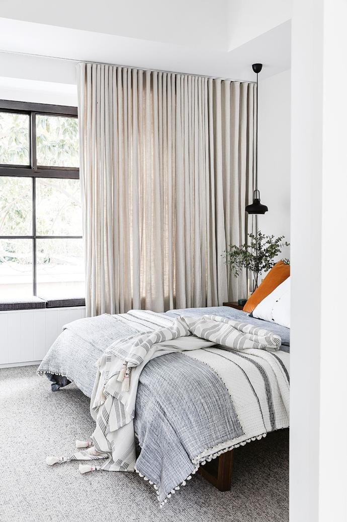 **Sitting pretty** This bedroom features a [window seat](https://www.homestolove.com.au/window-seats-7061|target="_blank") with hidden storage. "I try to include as much storage as I can and make it as invisible as possible," says architect Jeremy Bull. *Design: [Alexander&Co](https://alexanderand.co/|target="_blank"|rel="nofollow"). Build: [Fairweather Constructions](http://www.fairweatherconstructions.com/|target="_blank"|rel="nofollow"). Styling: Vanessa Colyer Tay. Photography: Maree Homer.*