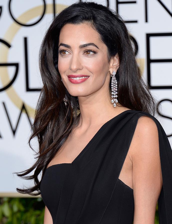 **FLAWLESS SKIN:** For the 2015 Golden Globes, go-to makeup artist Charlotte Tilbury got Amal's skin looking like perfection by applying [Magic Cream](http://www.charlottetilbury.com/au/charlottes-magic-cream.html) to Amal's entire face, followed by [Wonderglow](http://www.charlottetilbury.com/au/wonderglow.html|target="_blank"|rel="nofollow") face primer then [Light Wonder foundation](http://products-au.charlottetilbury.com/au/search?w=Light%20Wonder%20foundation|target="_blank"|rel="nofollow"). "I went into knowing what she likes, so I created a retro beauty look inspired by the silver screen sirens that fits her classic style," Charlotte [wrote on her website](http://www.charlottetilbury.com/au/products/golden-globes-amal-clooney.html|target="_blank"|rel="nofollow").