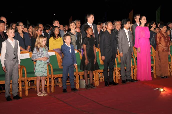 Angelina and her kids Shiloh, Vivienne, Knox, Zahara, Pax and Maddox listen to the Cambodian national anthem during the the premiere of her film *First They Killed My Father.*