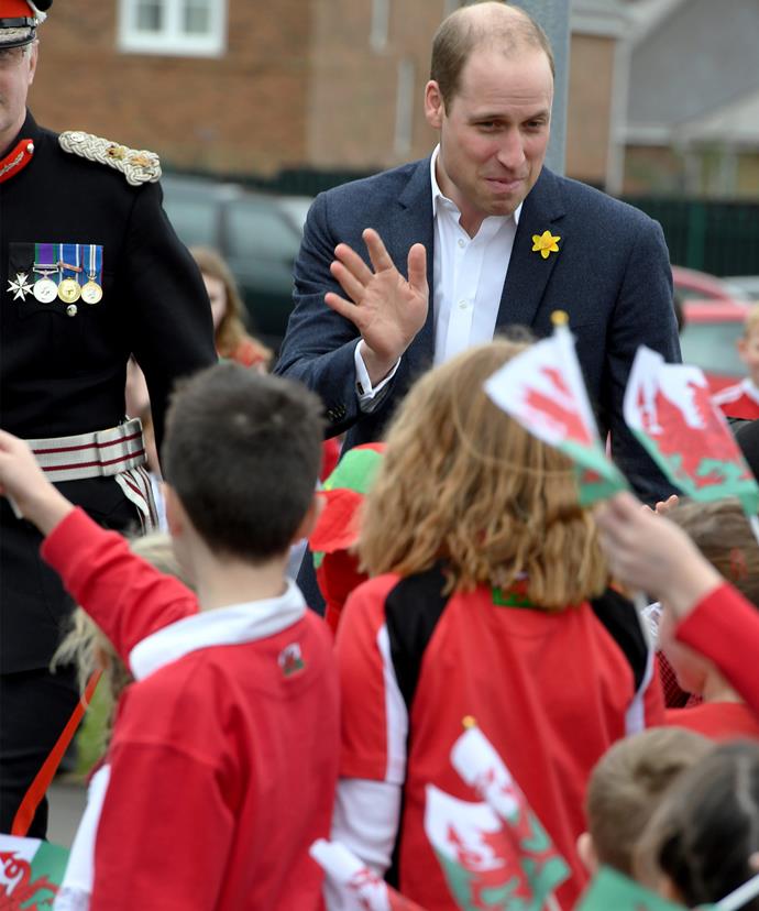 The prince wore a yellow daffodil on his lapel in honor of Wales’ national symbol.