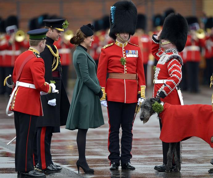 In 2013, Duchess Catherine braved the rain to present the Irish Shamrocks. The Duchess wore a military-inspired Emilia Wickstead dress coat, and was five months pregnant at the time with Prince George.