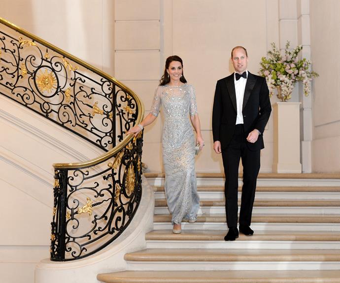 **March:** To celebrate their stay in Paris, the royal couple were the guests of honour at a dinner thrown at the British Embassy. The Duchess wore a shimmering, pale blue Jenny Packham dress.